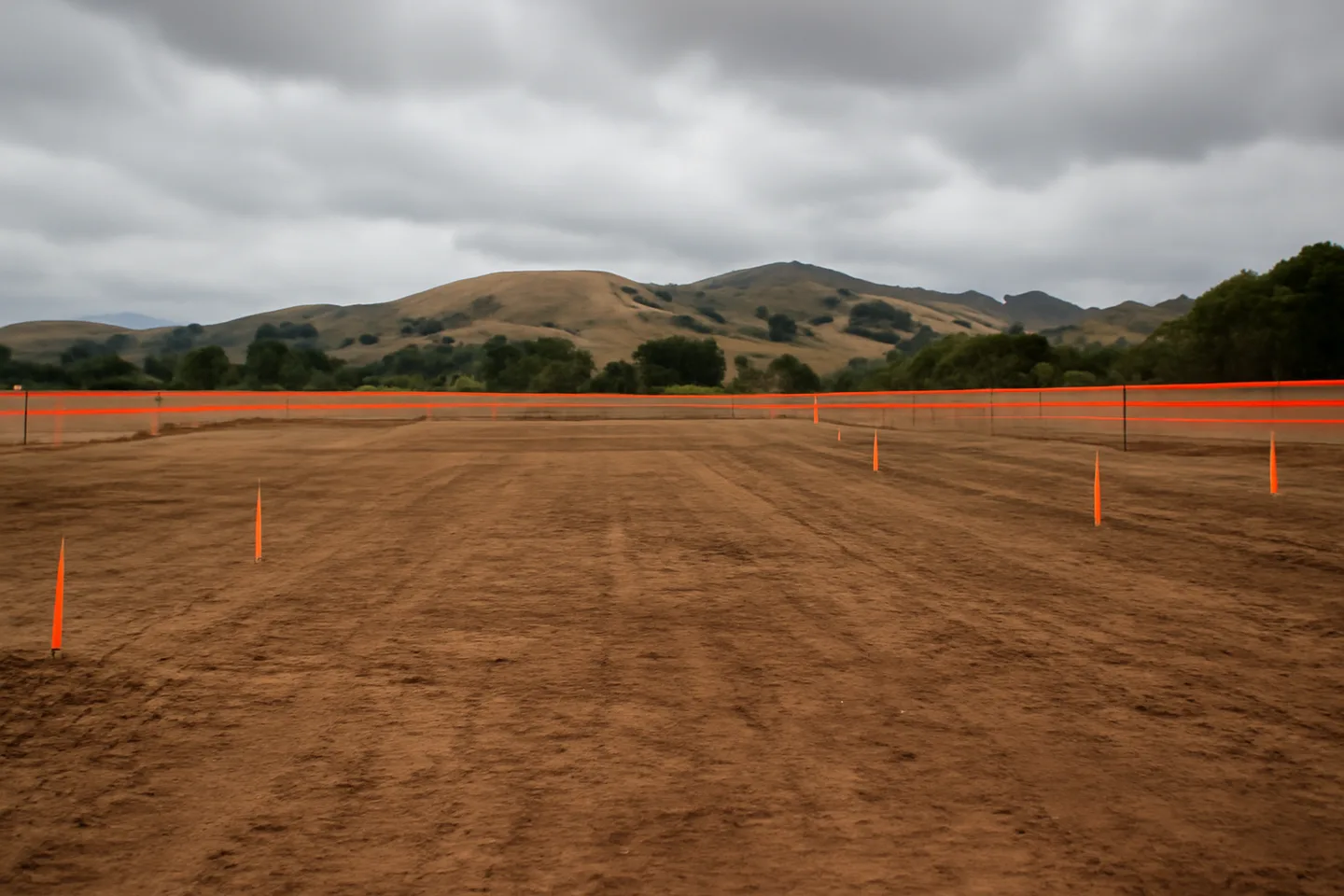 Graded construction lot with utility stakes